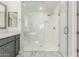 Spa-like bathroom with a large walk-in shower with subway tile and glass enclosure at 8569 N 175Th Ln, Waddell, AZ 85355