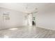 Bright and airy bedroom with ceiling fan and wood-look tile flooring at 8569 N 175Th Ln, Waddell, AZ 85355