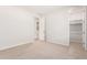 Bedroom with neutral carpet and an adjacent closet at 8569 N 175Th Ln, Waddell, AZ 85355