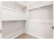 Simple closet with hanging rods and additional shelving at 8569 N 175Th Ln, Waddell, AZ 85355