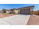 Attached two-car garage with concrete driveway at 8569 N 175Th Ln, Waddell, AZ 85355