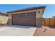 Two-car garage with decorative door at 8569 N 175Th Ln, Waddell, AZ 85355