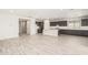 Open concept kitchen with island, gray cabinets and white quartz countertops at 8569 N 175Th Ln, Waddell, AZ 85355