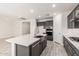 Spacious kitchen featuring an island, stainless steel appliances, and gray cabinets at 8569 N 175Th Ln, Waddell, AZ 85355