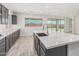 Modern kitchen with island, stainless steel appliances, and white quartz countertops at 8569 N 175Th Ln, Waddell, AZ 85355