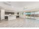 Open concept kitchen with island, gray cabinets, and white quartz countertops at 8569 N 175Th Ln, Waddell, AZ 85355