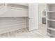 Large walk-in closet with double hanging rods and shelving at 8569 N 175Th Ln, Waddell, AZ 85355