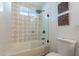 Updated bathroom with patterned tile shower and new bathtub at 8732 E Valley Vista Dr, Scottsdale, AZ 85250