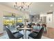 Bright dining area with modern chandelier and sliding glass doors at 8732 E Valley Vista Dr, Scottsdale, AZ 85250