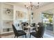 Bright dining area with built-in shelving and modern chandelier at 8732 E Valley Vista Dr, Scottsdale, AZ 85250