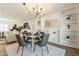 Open concept dining area with built-in shelves and chandelier at 8732 E Valley Vista Dr, Scottsdale, AZ 85250