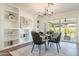 Bright dining room with built-in shelving and backyard access at 8732 E Valley Vista Dr, Scottsdale, AZ 85250