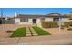 Modern curb appeal with artificial turf and walkway at 8732 E Valley Vista Dr, Scottsdale, AZ 85250