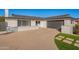 House exterior with modern dark gray garage door at 8732 E Valley Vista Dr, Scottsdale, AZ 85250