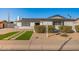 Charming single story home with artificial turf and walkway at 8732 E Valley Vista Dr, Scottsdale, AZ 85250