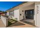 Front entry with modern black door and welcome mat at 8732 E Valley Vista Dr, Scottsdale, AZ 85250