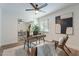 Home office with wood desk, ceiling fan, and ample natural light at 8732 E Valley Vista Dr, Scottsdale, AZ 85250