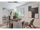 Home office with wood desk, ceiling fan, and ample natural light at 8732 E Valley Vista Dr, Scottsdale, AZ 85250