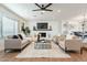 Bright living room with comfy seating, a fireplace, and large windows at 8732 E Valley Vista Dr, Scottsdale, AZ 85250