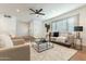 Living room with comfy seating, a coffee table and large windows at 8732 E Valley Vista Dr, Scottsdale, AZ 85250