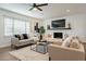 Spacious living room featuring a cozy fireplace and stylish decor at 8732 E Valley Vista Dr, Scottsdale, AZ 85250