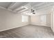 Bright bedroom with exposed beams, ceiling fan, and plush carpet at 874 E Tyson St, Chandler, AZ 85225