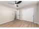 Bedroom with laminate flooring, ceiling fan and access to hallway at 874 E Tyson St, Chandler, AZ 85225