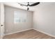 Bright bedroom with ceiling fan and wood-look floors at 874 E Tyson St, Chandler, AZ 85225