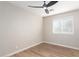 Bedroom with window, ceiling fan and laminate wood flooring at 874 E Tyson St, Chandler, AZ 85225