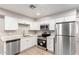 Modern kitchen with white cabinets and stainless steel appliances at 874 E Tyson St, Chandler, AZ 85225