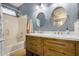 Modern bathroom with double vanity and oval mirrors at 8805 W Windrose Dr, Peoria, AZ 85381