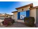 Close-up view of a house exterior with blue shutters and landscaping at 8805 W Windrose Dr, Peoria, AZ 85381