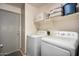 Convenient laundry room with washer and dryer at 8805 W Windrose Dr, Peoria, AZ 85381