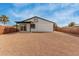 Backyard view of house, gravel, wood fence at 902 S 96Th St, Mesa, AZ 85208