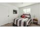 Small bedroom with a full-size bed and simple decor at 902 S 96Th St, Mesa, AZ 85208