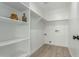 Laundry room with white shelving and vinyl flooring at 902 S 96Th St, Mesa, AZ 85208