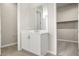Clean bathroom with white vanity and access to closet at 10229 N 177Th Dr, Waddell, AZ 85355