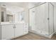 Modern bathroom with white cabinets and a large shower at 10229 N 177Th Dr, Waddell, AZ 85355
