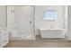 Elegant bathroom featuring a soaking tub and walk-in shower at 10229 N 177Th Dr, Waddell, AZ 85355