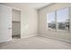 Bright bedroom with a large window and spacious closet at 10229 N 177Th Dr, Waddell, AZ 85355