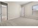 Spacious bedroom with neutral walls and carpet at 10229 N 177Th Dr, Waddell, AZ 85355