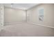 Bright bedroom with carpet, dual windows, and access to bathroom at 10229 N 177Th Dr, Waddell, AZ 85355