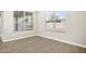 Spacious bedroom with tile floors and large windows at 10229 N 177Th Dr, Waddell, AZ 85355