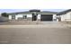 Modern single-story home with stone accents and a two-car garage at 10229 N 177Th Dr, Waddell, AZ 85355