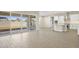 Bright kitchen with island, stainless steel appliances, and backyard access at 10229 N 177Th Dr, Waddell, AZ 85355
