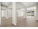 Open living area with tile floors and large windows at 10229 N 177Th Dr, Waddell, AZ 85355