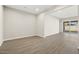 Open concept living space with tile floors and access to backyard at 10229 N 177Th Dr, Waddell, AZ 85355