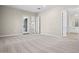 Main bedroom with carpet flooring, doors to backyard and bathroom at 10229 N 177Th Dr, Waddell, AZ 85355