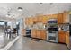 Kitchen with wood cabinets, granite counters and stainless appliances at 10998 W San Lazaro Dr, Arizona City, AZ 85123