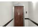Apartment entrance with a classic wood door and Art Deco-inspired trim at 114 W Adams St # 203, Phoenix, AZ 85003